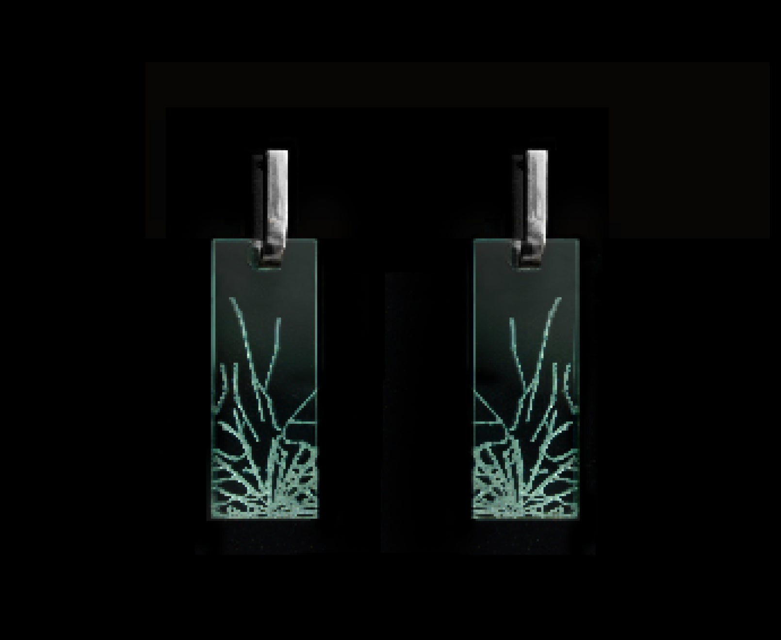 Bold acrylic earrings with a faux fractured glass, symbolizing a shattered glass ceiling, mid-length rectangle design with silver metal.