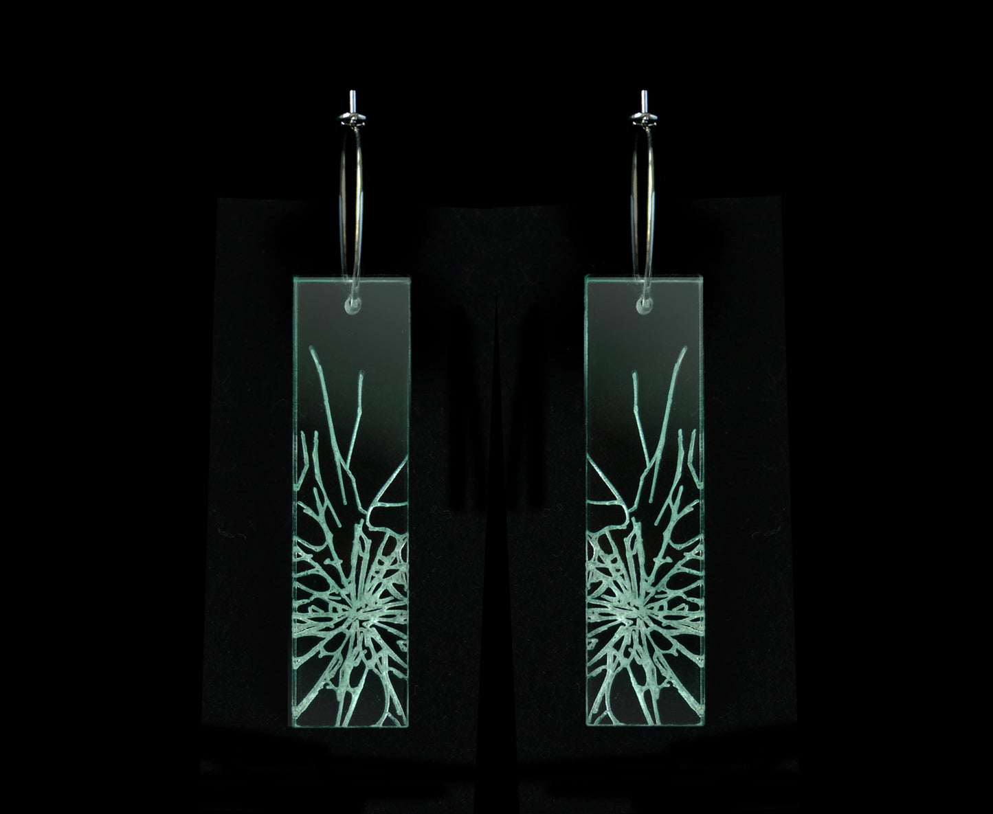 Laser-cut earrings in a shattered glass shape symbolizing gender equality, long rectangle style.