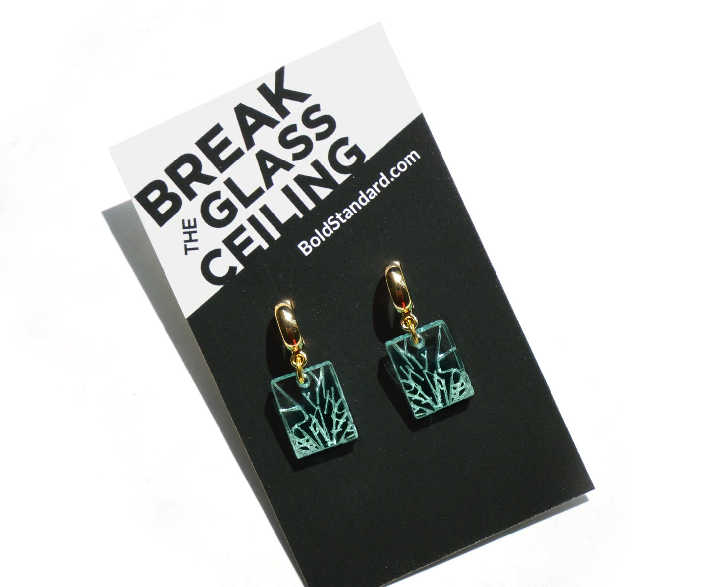 Glass Ceiling Earrings with branded packaging.