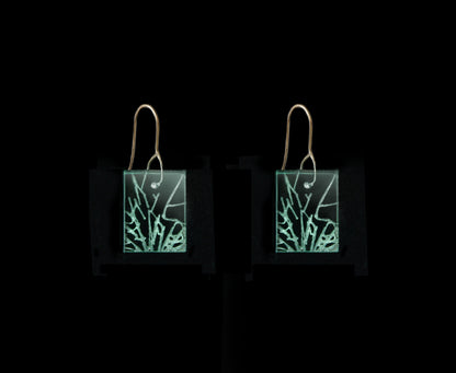 Statement earrings with shattered glass appearance, representing breaking the glass ceiling, short rectangle design with gold metal hook.