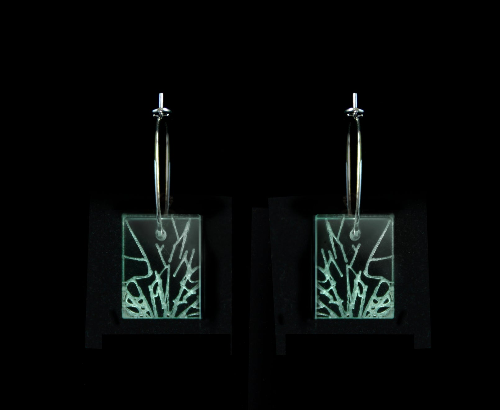 Laser-cut earrings in a shattered glass shape symbolizing gender equality, short rectangle style.